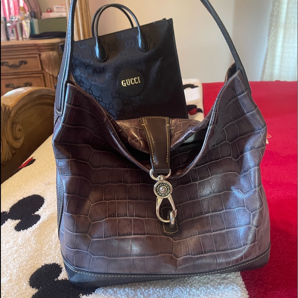 Chocolate brown Dooney & Bourke purse with matching makeup bag